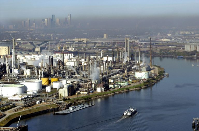 Aerial view of refineries along a ship channel