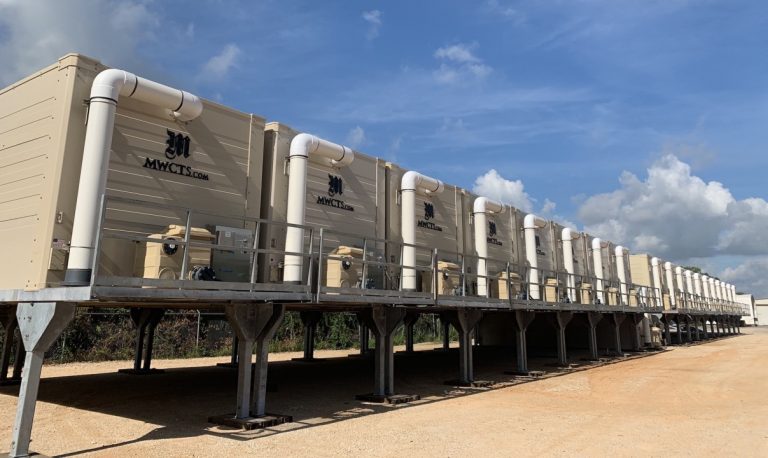 Line of MWCTS rental cooling tower modules on site